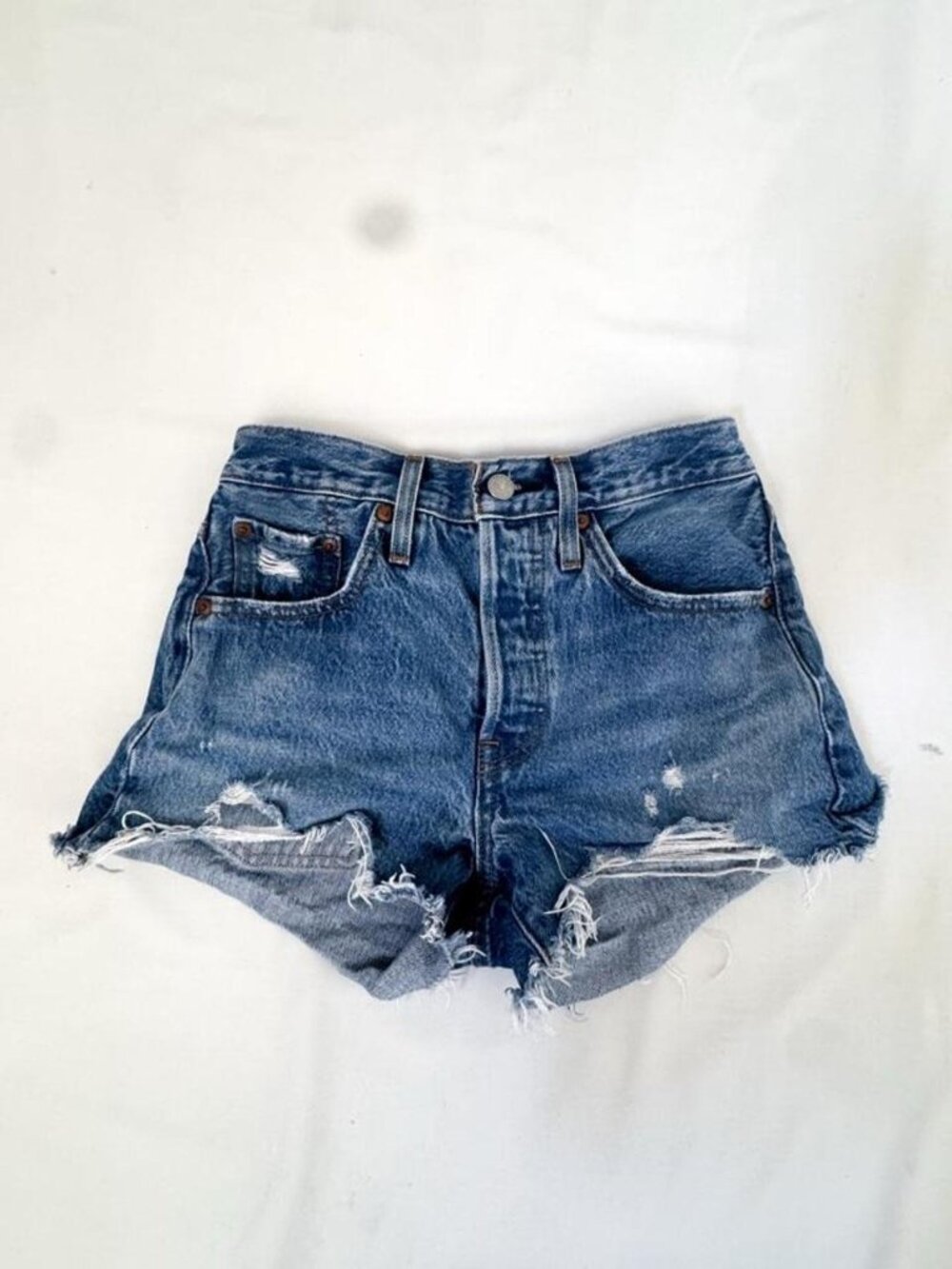 Vintage late 90’s Levis denim micro shorts with distressed hems and tears